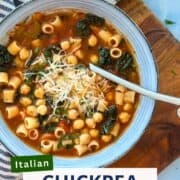 Close-up of Italian chickpea pasta soup in a blue bowl topped with Parmesan and fresh herbs — hearty Mediterranean chickpea soup recipe ideal for easy lunches or weeknight meals.