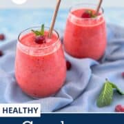 Healthy cranberry smoothie served in two glasses with metal straws, topped with mint and cranberries. Easy vegan cranberry smoothie recipe using fresh or frozen cranberries, clementines, banana, and frozen pineapple.