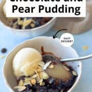 Close-up of chocolate and pear self-saucing pudding served warm in a bowl with vanilla ice cream and toasted almonds. Rich fudgy chocolate sauce and soft poached pear make this an easy baked winter dessert.