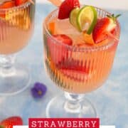 Refreshing strawberry sangria with rosé wine and fresh fruit garnishes.