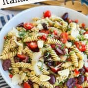 Colorful vegetarian Italian pasta salad with cherry tomatoes, olives, and mozzarella cheese. Perfect.
