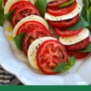 Classic Caprese salad with ripe tomatoes, fresh mozzarella, basil, and olive oil.