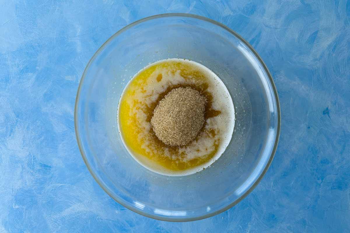 Melted butter, brown sugar, and vanilla paste combined in a mixing bowl to begin the crumble bar dough