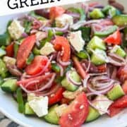 Vibrant Greek salad featuring tomatoes, cucumbers, red onions, and feta cheese, perfect for summer meals.