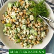 Fresh Mediterranean chickpea salad with cucumbers, feta, and herbs in a white bowl.