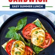 Delicious pesto caprese sandwich with fresh tomatoes, basil, and mozzarella cheese.
