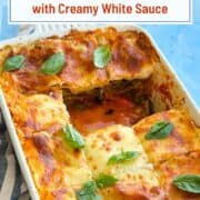 Delicious Mediterranean vegetable lasagna with creamy white sauce in a baking dish.