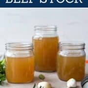 Homemade beef stock in glass jars for cooking and soups.